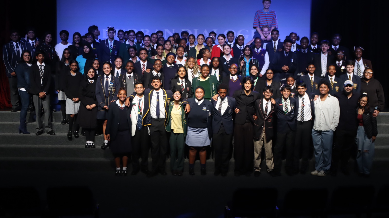 Speakers and coaches gathered on stage at the Durban Dialogue tournament